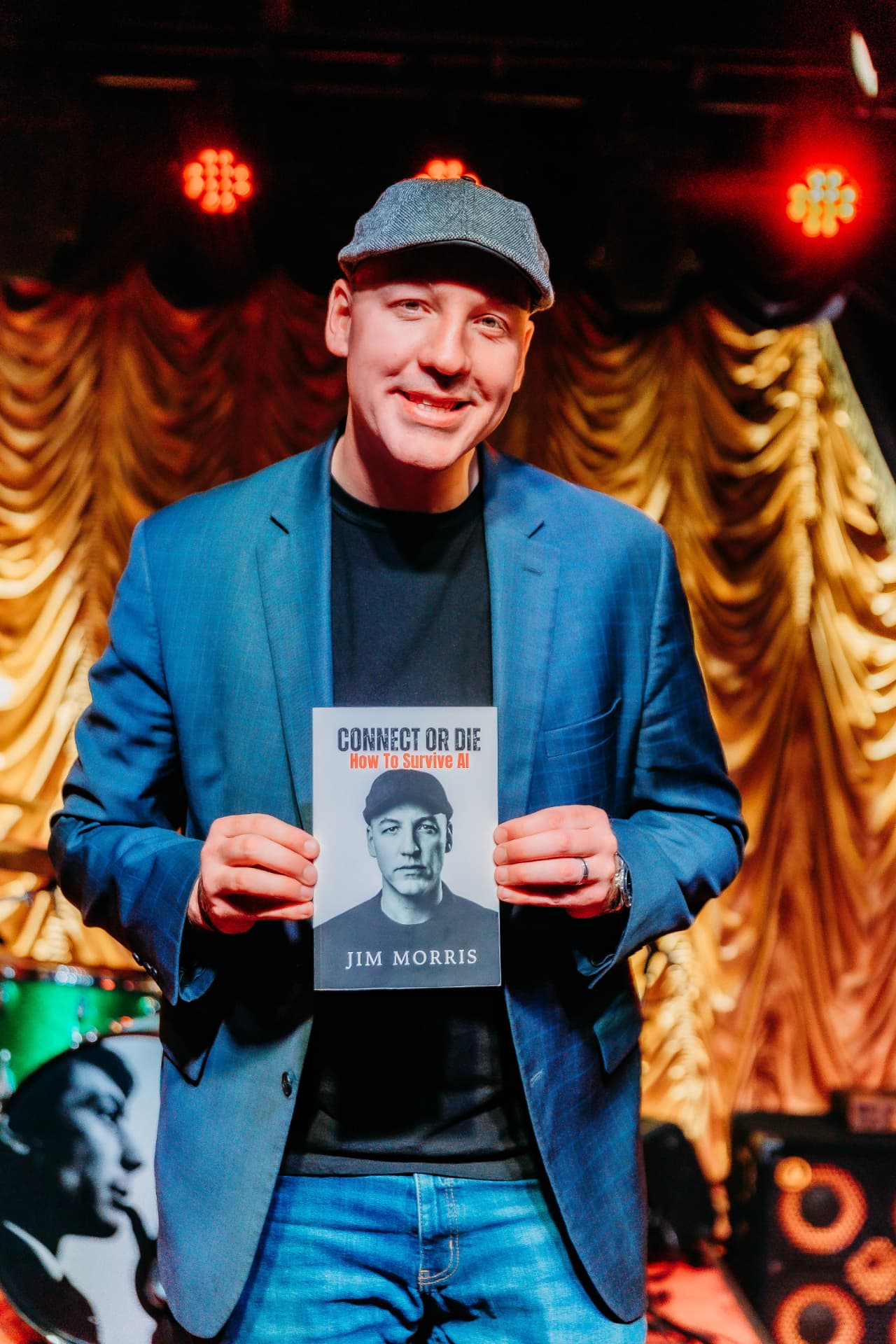 Jim Morris holding Connect or Die: How to Survive AI