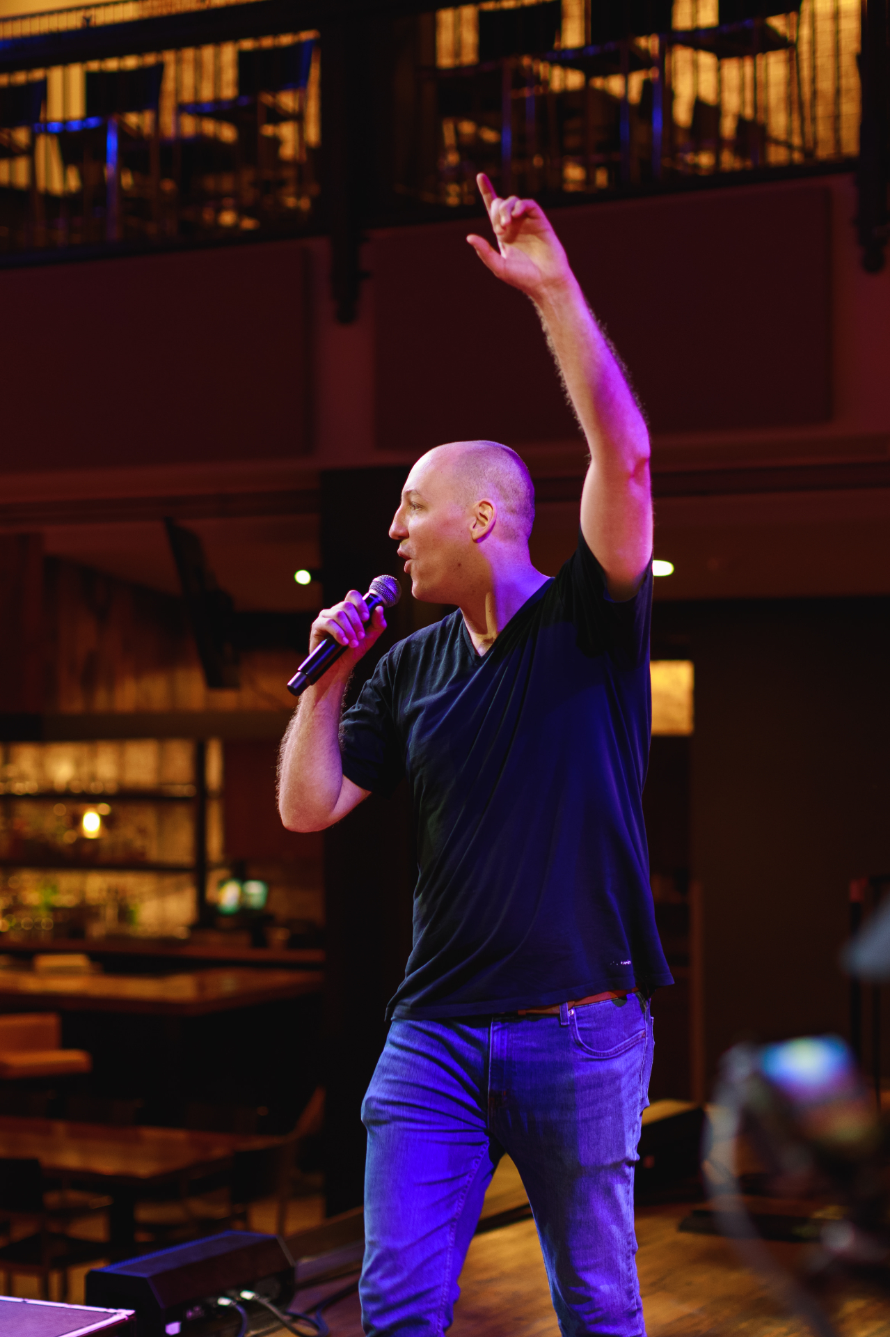 Jim Morris speaking on stage with a microphone